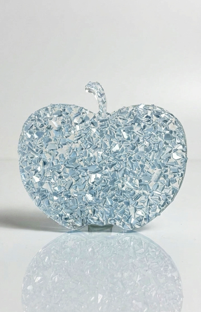Top-down studio shot of a thick apple casting with a realistic yellow crystal druzy texture covering the entire surface.