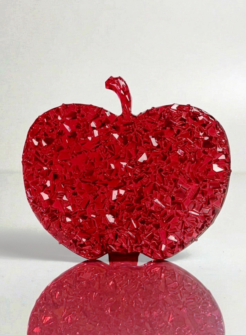 Macro close-up view showing the intricate mineral clusters and high-gloss crystalline druzy details on the apple surface.