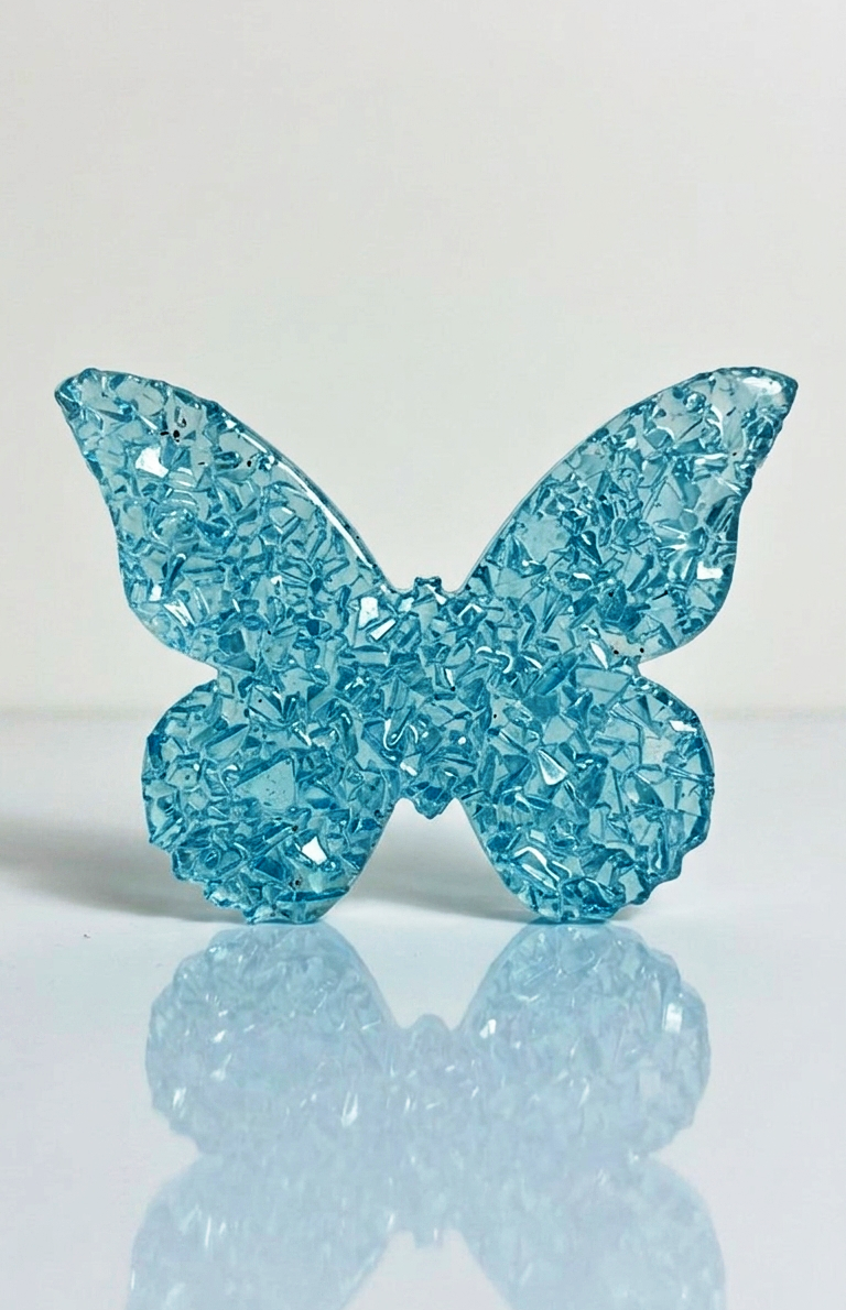 Macro close-up view showing the intricate mineral clusters and high-gloss
crystalline druzy details on the butterfly wings